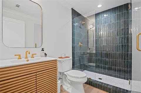 a view of a patio with couches chairs and wooden floor