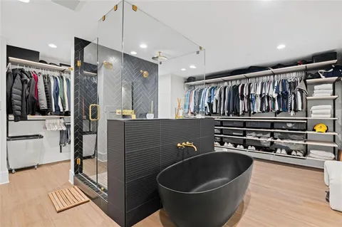 a view of a house with a wooden deck