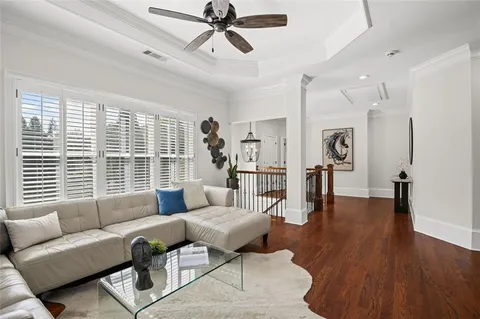 an aerial view of residential house with outdoor space and trees all around