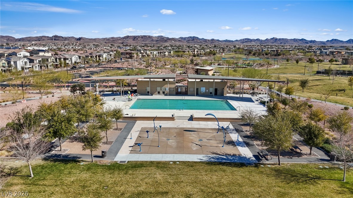 250 Dedication Avenue Henderson, NV 89011 - Photo 49 of 67 Community pool featuring a mountain view, a patio area, and a residential view