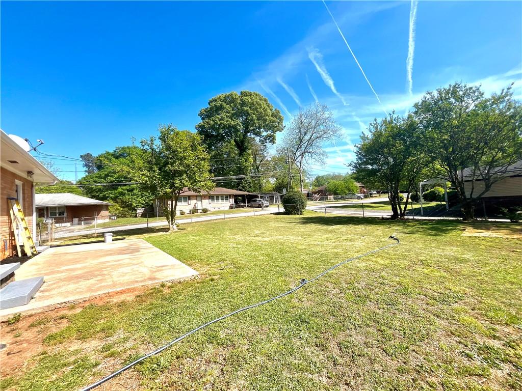 119 Fifth Avenue Jonesboro, GA 30236 - Photo 26 of 29 a view of swimming pool with lawn chairs under an umbrella