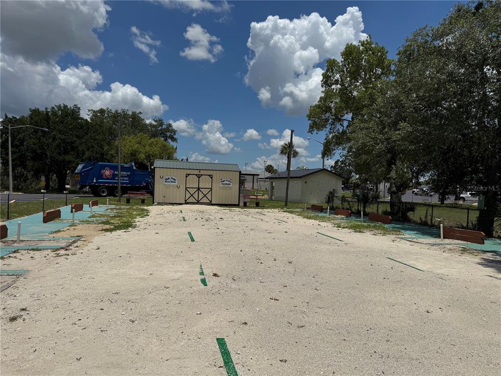 0 Highpoint Boulevard Brooksville, FL 34613 - Photo 7 of 16 a front view of a house with a yard and garage
