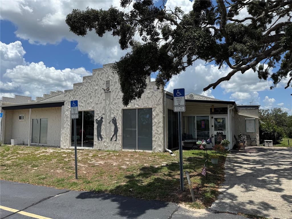 0 Highpoint Boulevard Brooksville, FL 34613 - Photo 9 of 16 a view of a house with a tree in front of it