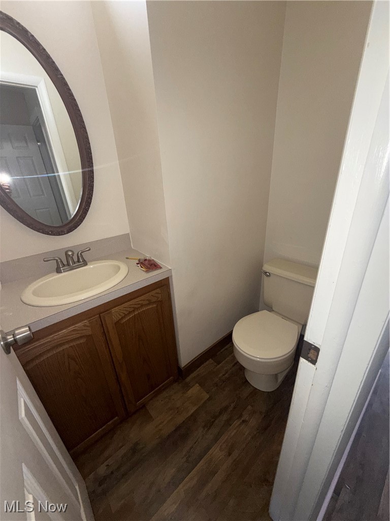 746 Wooster Road North Barberton, OH 44203 - Photo 5 of 44 Half bath featuring dark wood finished floors and vanity