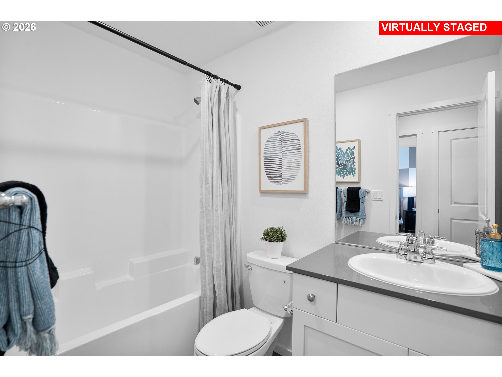 25248 Tanglewood Way Veneta, OR 97487 - Photo 20 of 28 a bathroom with a sink mirror vanity toilet and shower