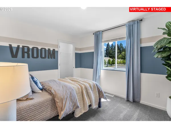 a bedroom with a bed and a potted plant