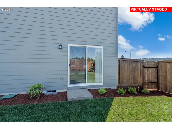 a backyard of a house with lots of green space