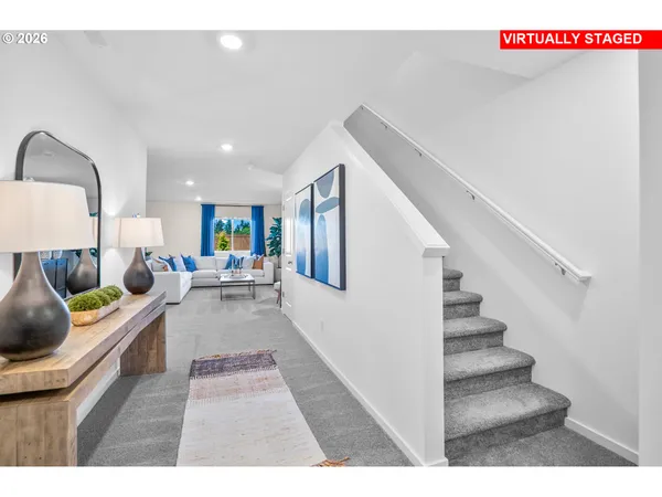 a kitchen with stainless steel appliances granite countertop a sink refrigerator and cabinets