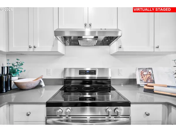 a kitchen with stainless steel appliances a refrigerator sink and cabinets