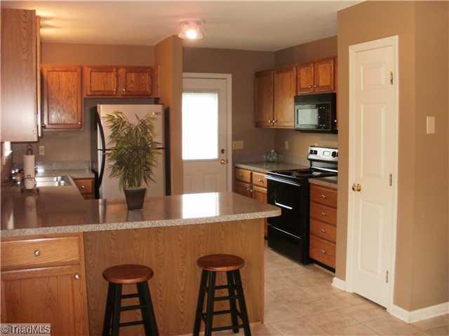 180 Farmview Road Madison, NC 27025 - Photo 8 of 16 Kitchen. Spacious open kitchen with bar area and large pantry