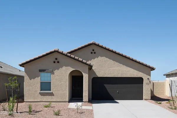 a front view of a house with parking