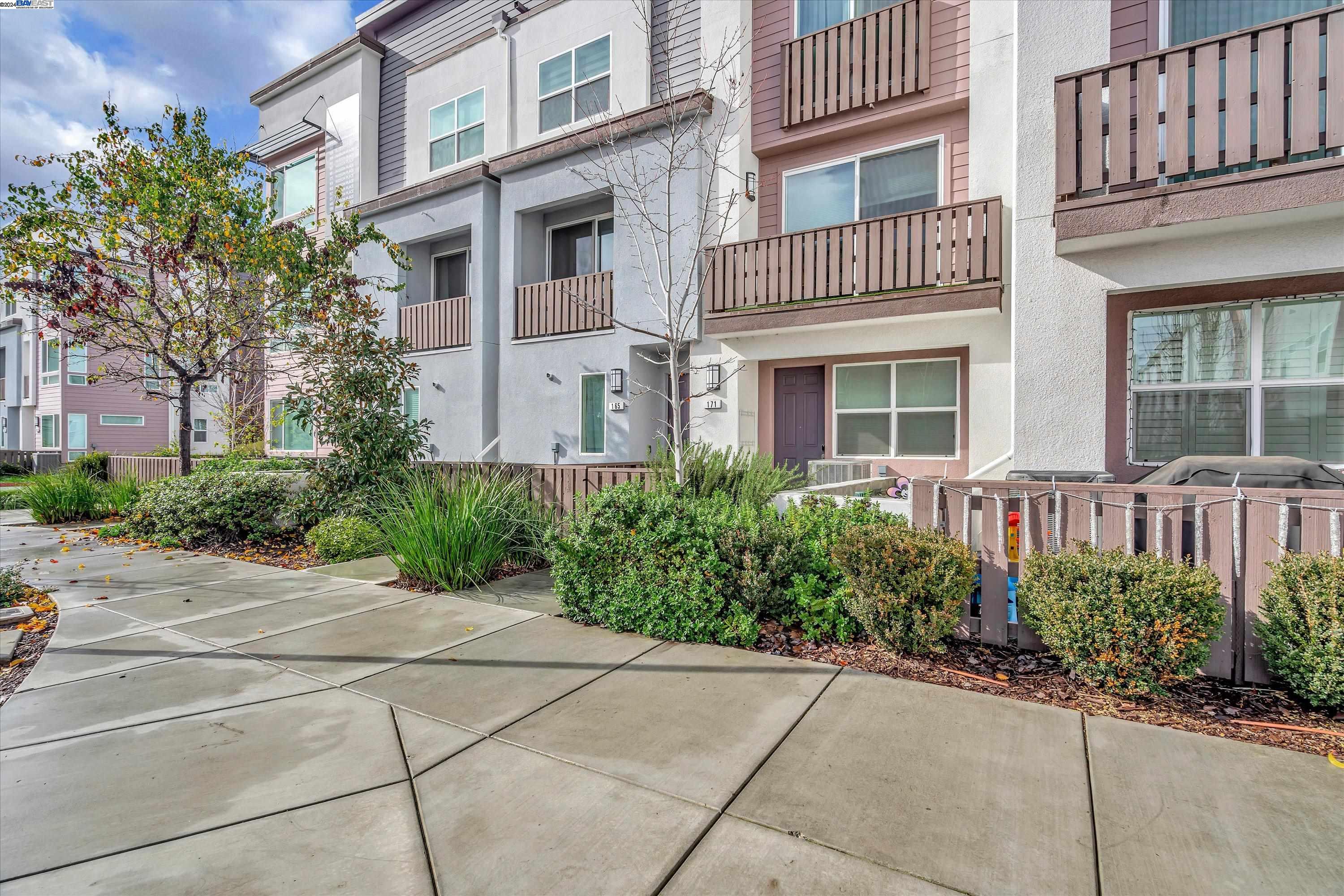 165 Ellicott Loop San Jose, CA 95123 - Photo 1 of 1 a view of a building with potted plants