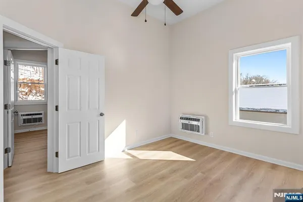 a view of a room with shelf on the wall