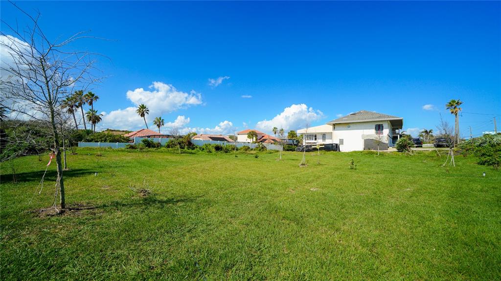 4738 South Atlantic Avenue Ponce Inlet, FL 32127 - Photo 28 of 32 a front view of a house with garden