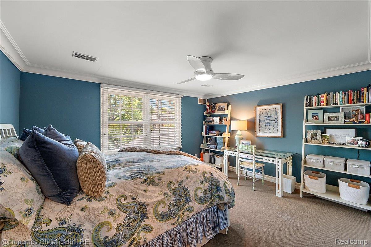 135 Clifton Road Bloomfield Hills, MI 48301 - Photo 59 of 77 Spacious room featuring broad windows with blinds, a ceiling fan, and carpeted flooring
