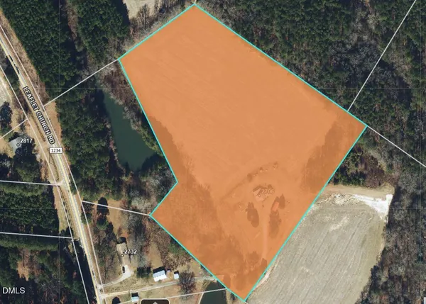 a view of a balcony with wooden floor and fence