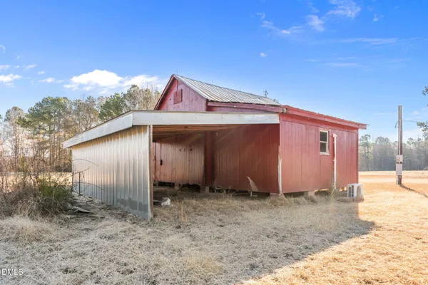 a backyard of a house with shaded area