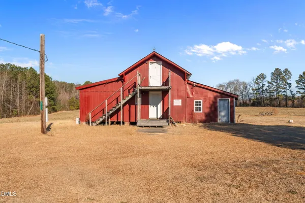 a view of a house with a snow in the yard