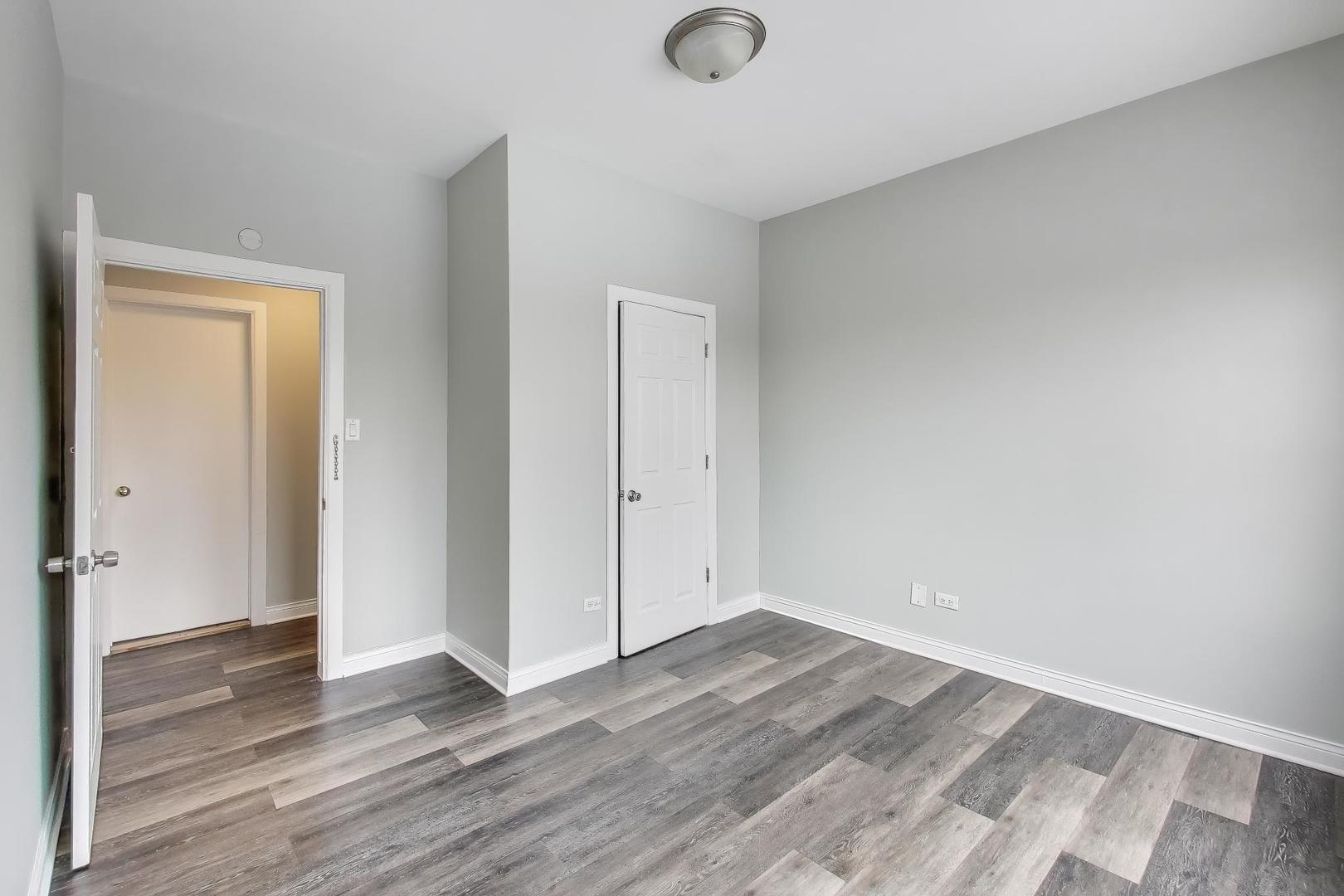 5938 South Indiana Avenue, Unit 2 Chicago, IL 60637 - Photo 13 of 17 an empty room with wooden floor