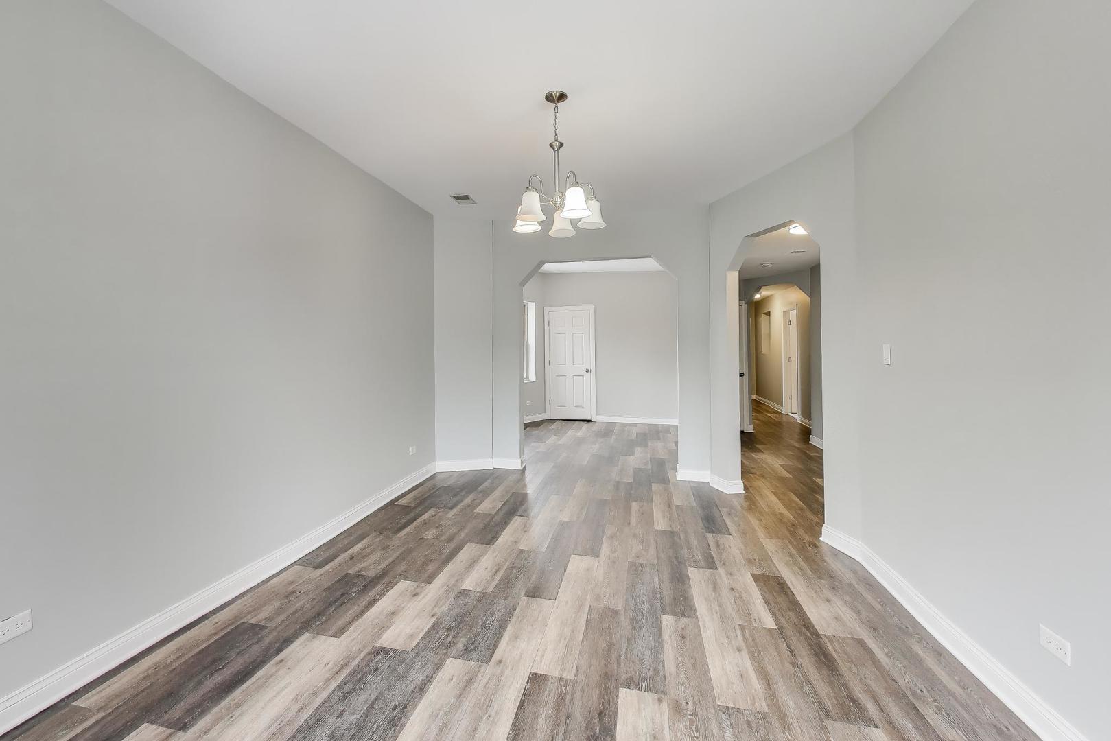 5938 South Indiana Avenue, Unit 2 Chicago, IL 60637 - Photo 3 of 17 a view of a room with wooden floor closet and windows