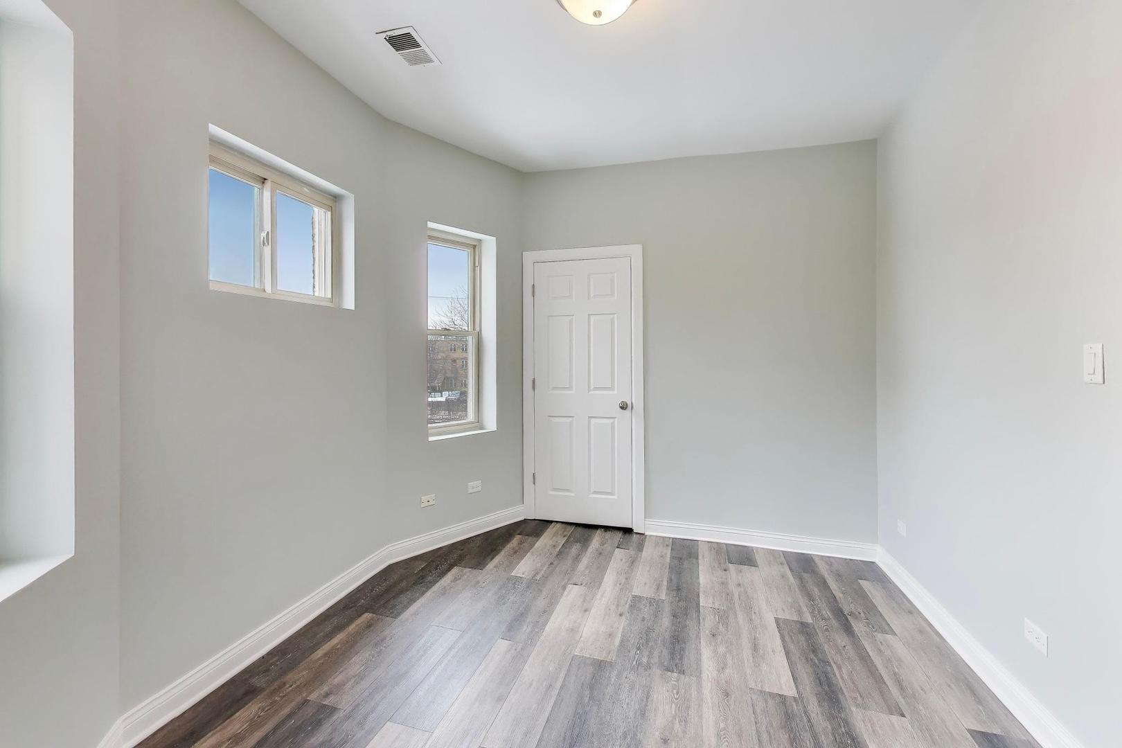 5938 South Indiana Avenue, Unit 2 Chicago, IL 60637 - Photo 6 of 17 a view of a room with wooden floor and a window