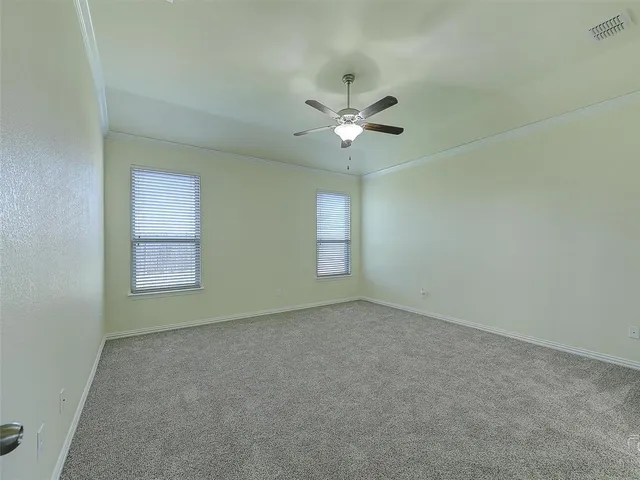 a view of empty room with fan