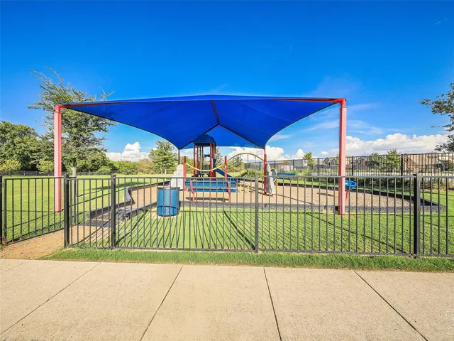 a view of a deck with a floor to ceiling windows