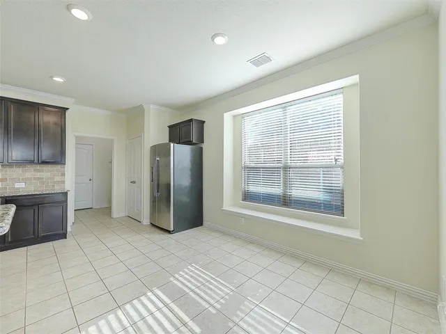 a view of a kitchen with a sink and dishwasher cabinets