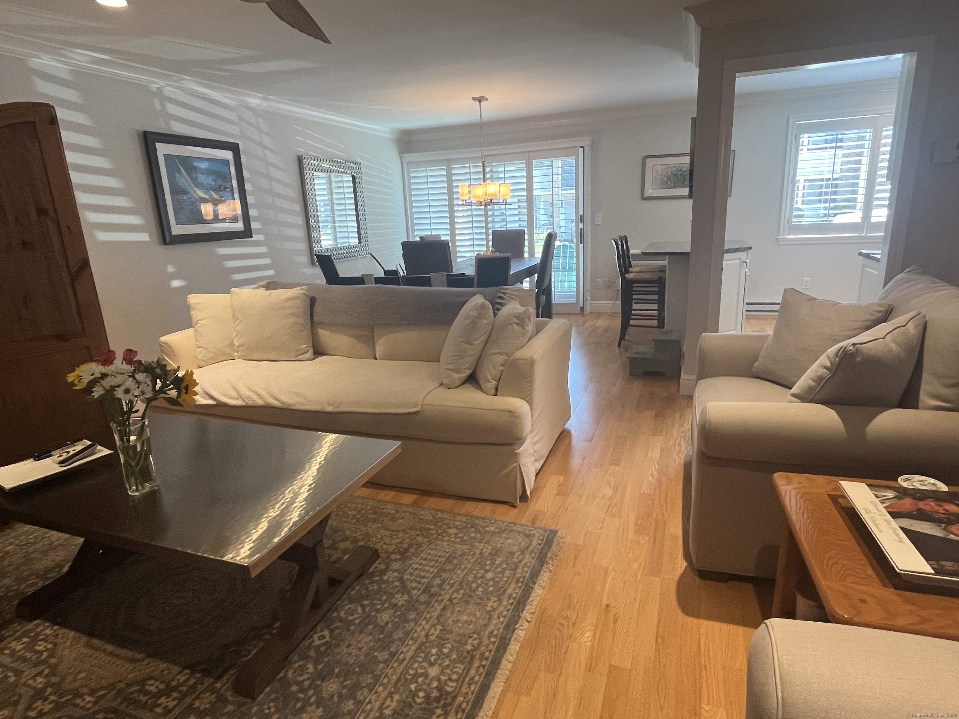 199 Gregory Boulevard, Unit E4 Norwalk, CT 06855 - Photo 2 of 18 a living room with furniture and wooden floor
