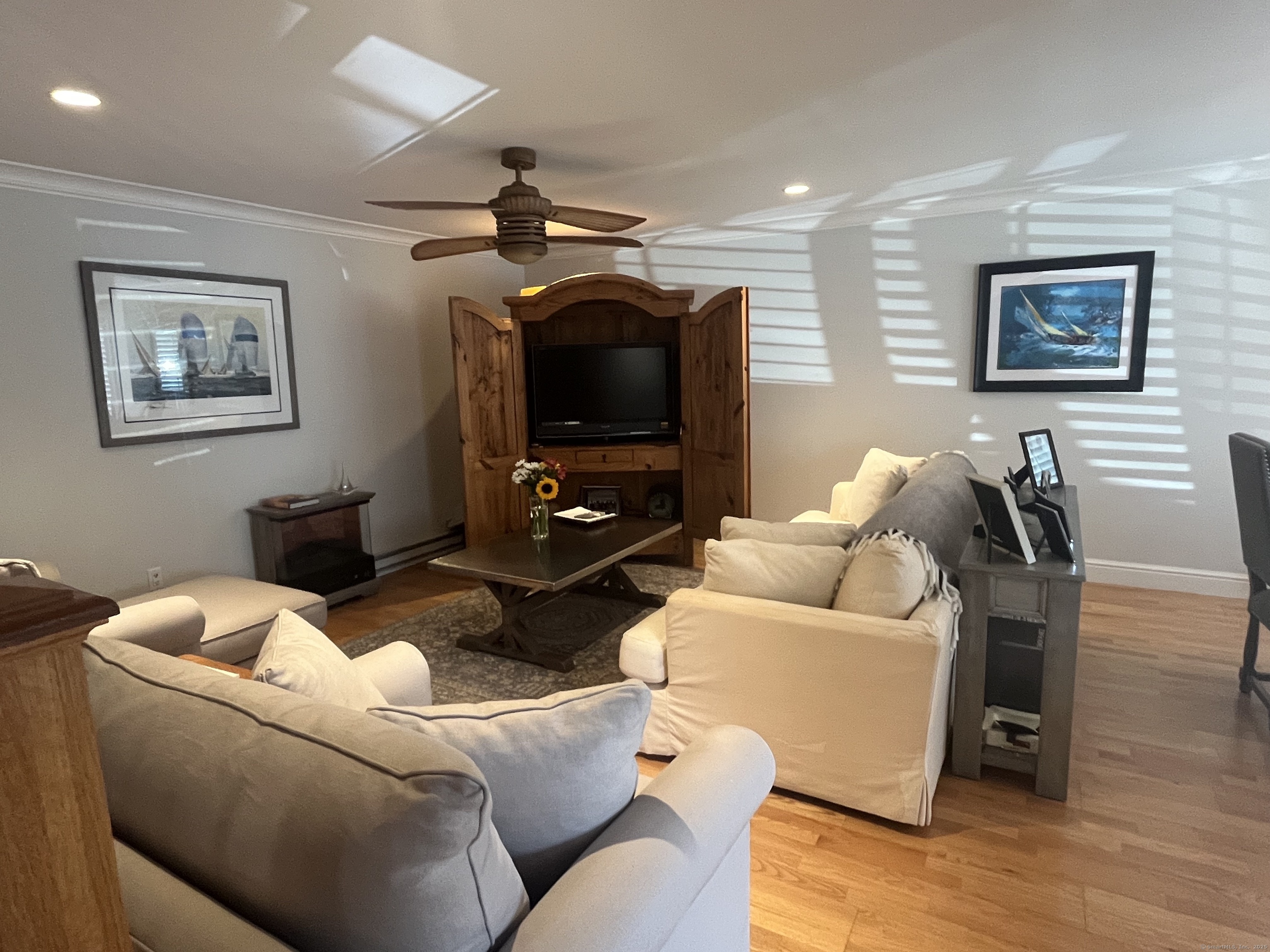 199 Gregory Boulevard, Unit E4 Norwalk, CT 06855 - Photo 5 of 18 a living room with furniture and a flat screen tv