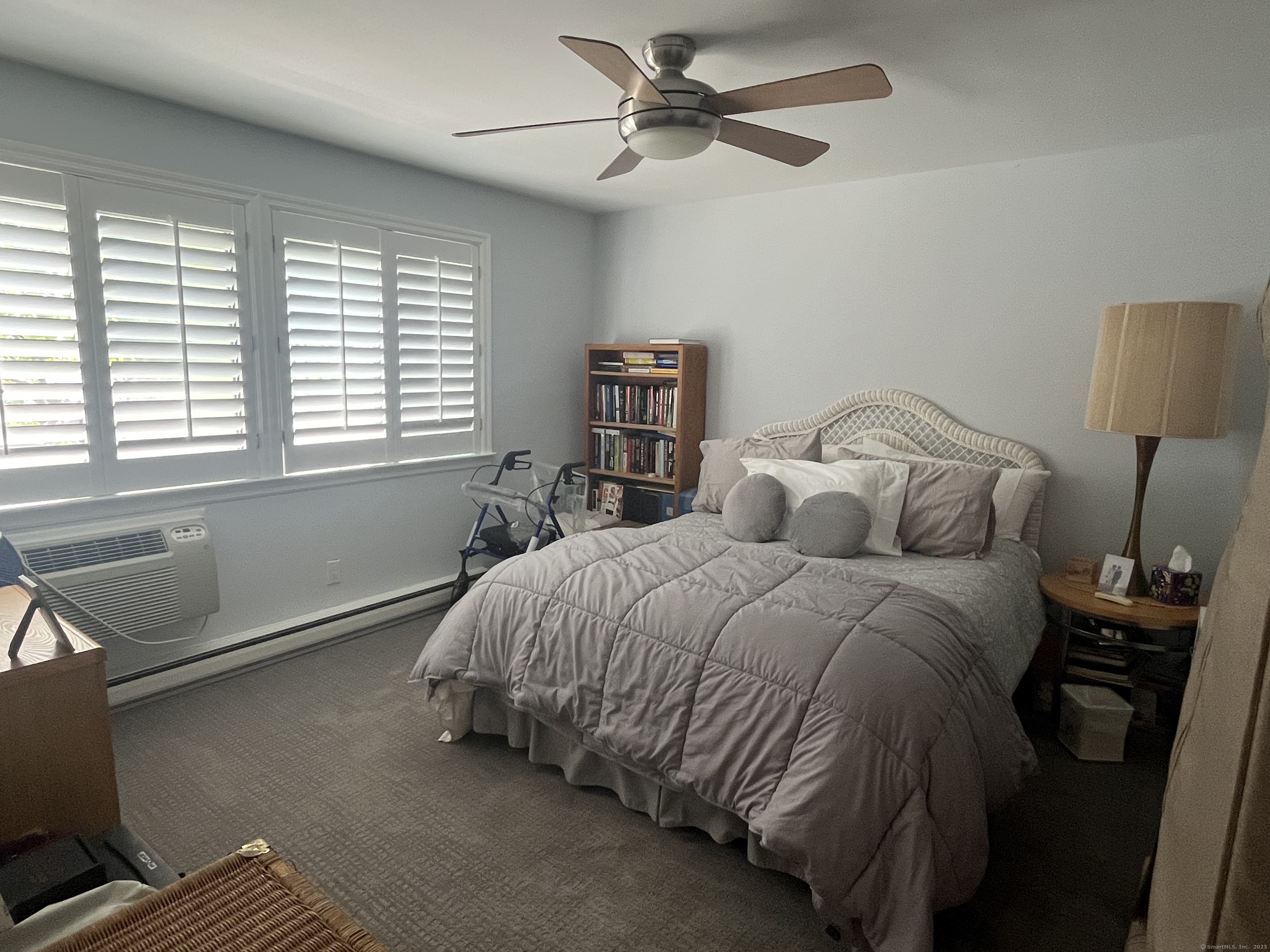 199 Gregory Boulevard, Unit E4 Norwalk, CT 06855 - Photo 6 of 18 a bed sitting in a bedroom next to a window