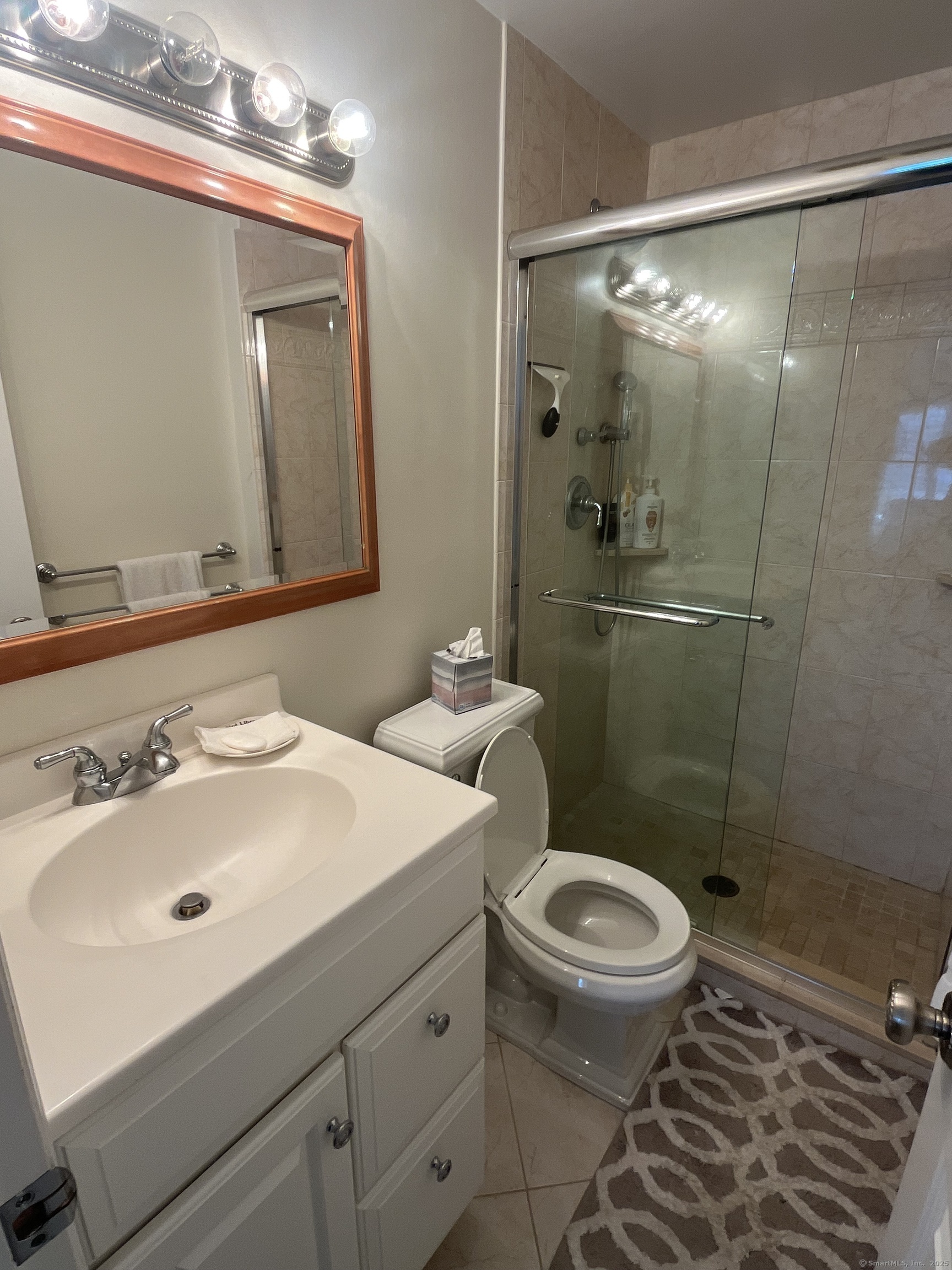 199 Gregory Boulevard, Unit E4 Norwalk, CT 06855 - Photo 10 of 18 a bathroom with a sink toilet and shower