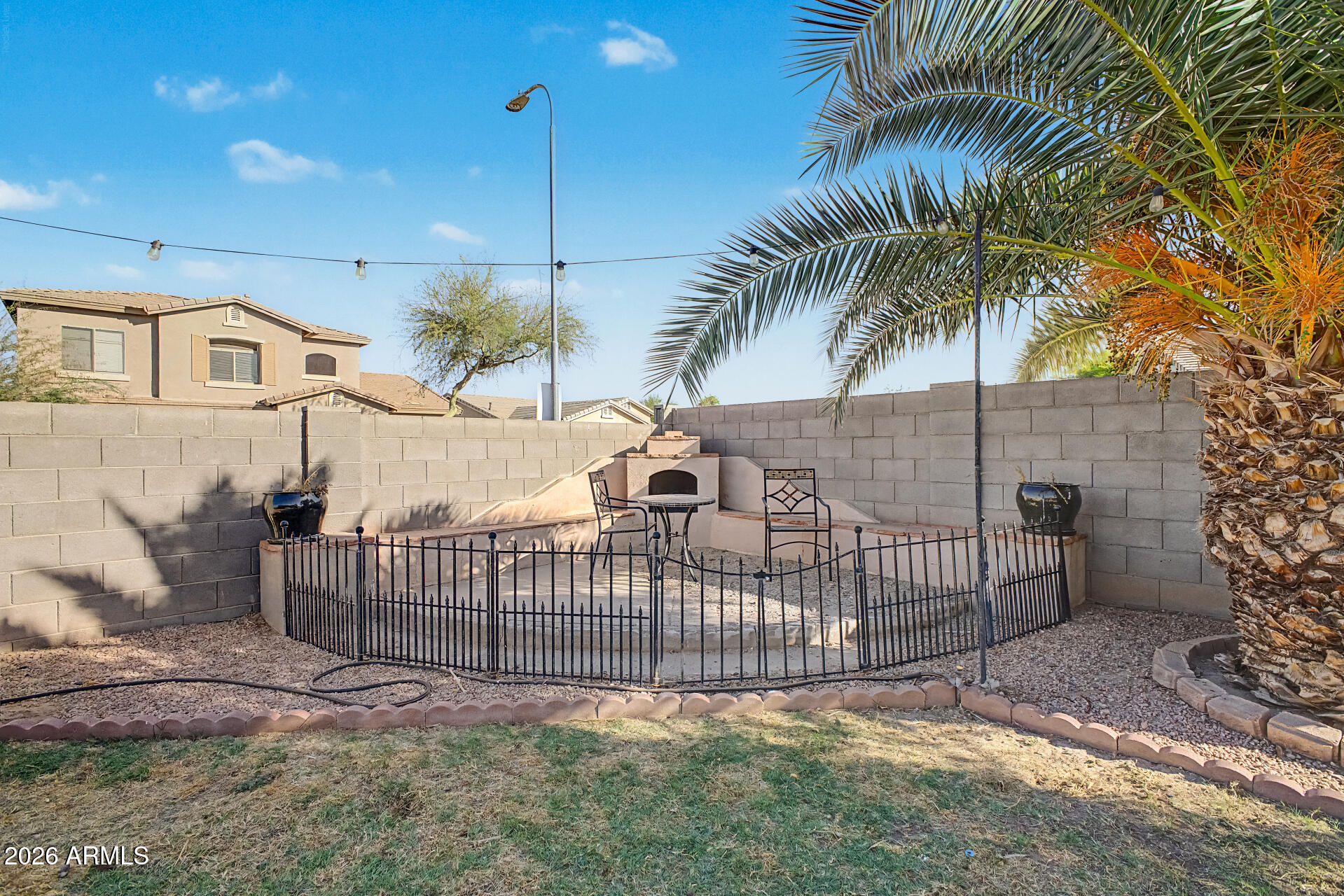 5301 West Grenadine Road Laveen, AZ 85339 - Photo 34 of 37 a view of a wrought iron fences in front of a house