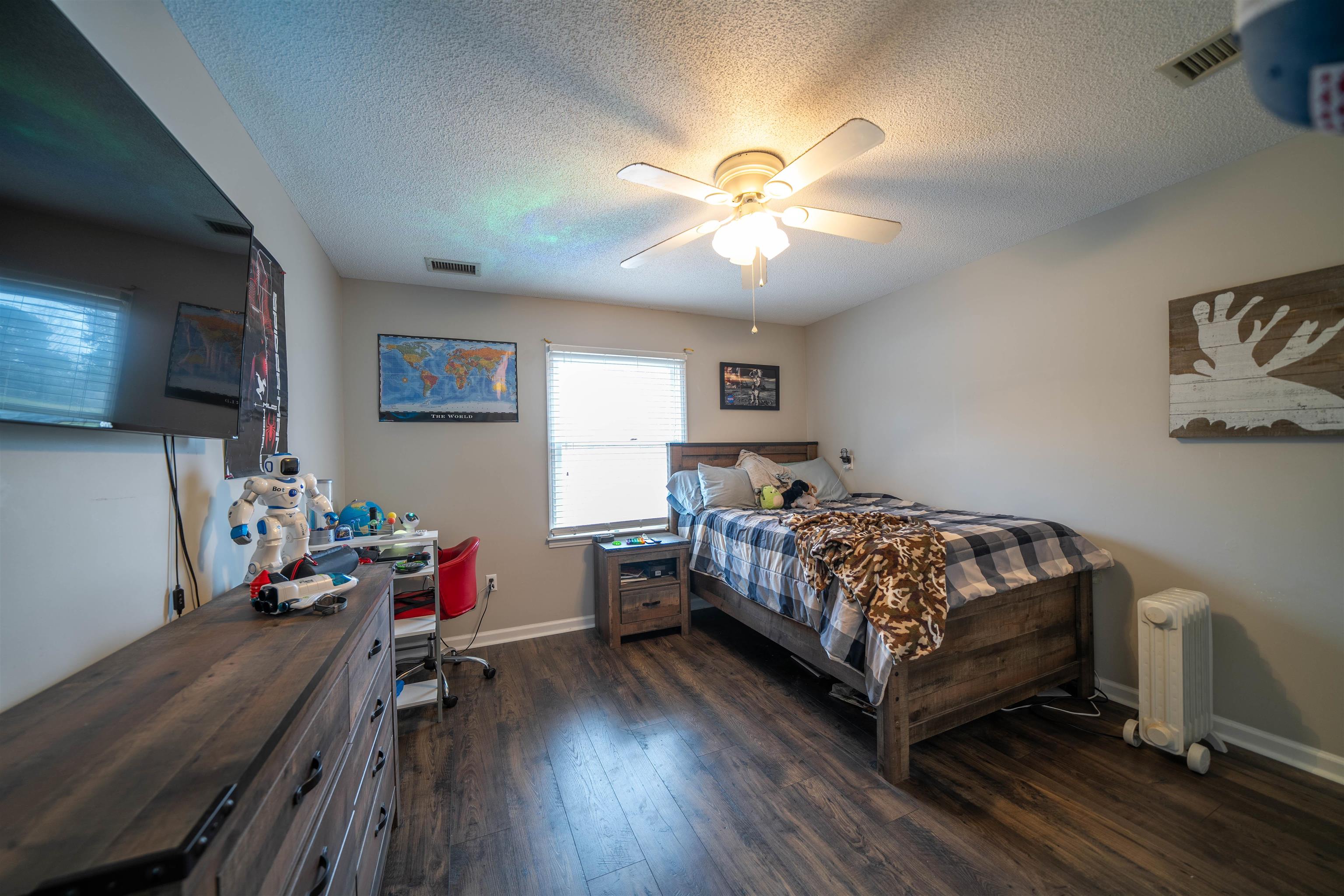 285 Woodbridge Road Somerville, TN 38068 - Photo 14 of 24 a bedroom with a bed and a chandelier