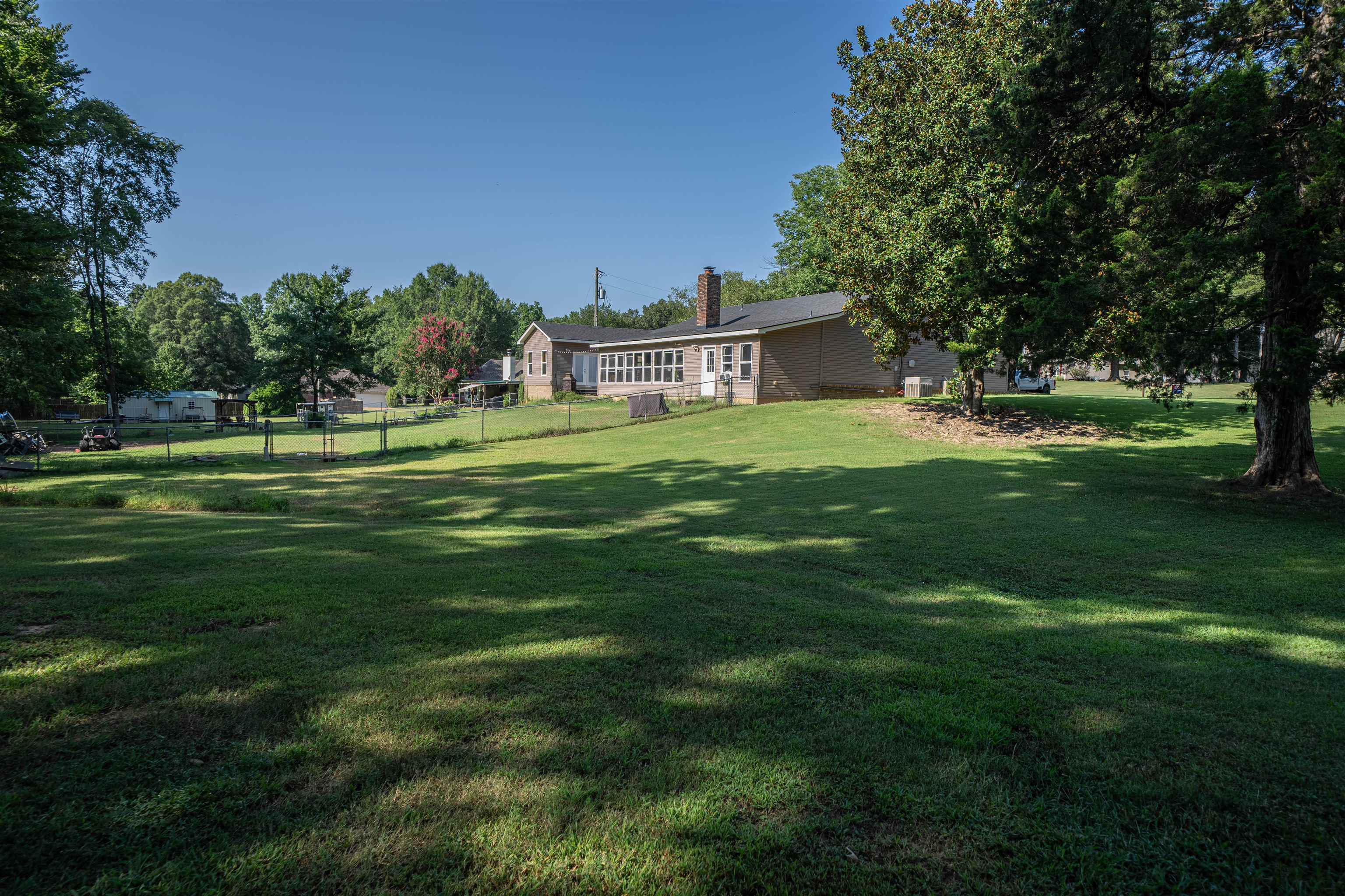 285 Woodbridge Road Somerville, TN 38068 - Photo 16 of 24 a front view of a house with a yard table and chairs