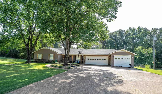 a front view of house with yard and seating area
