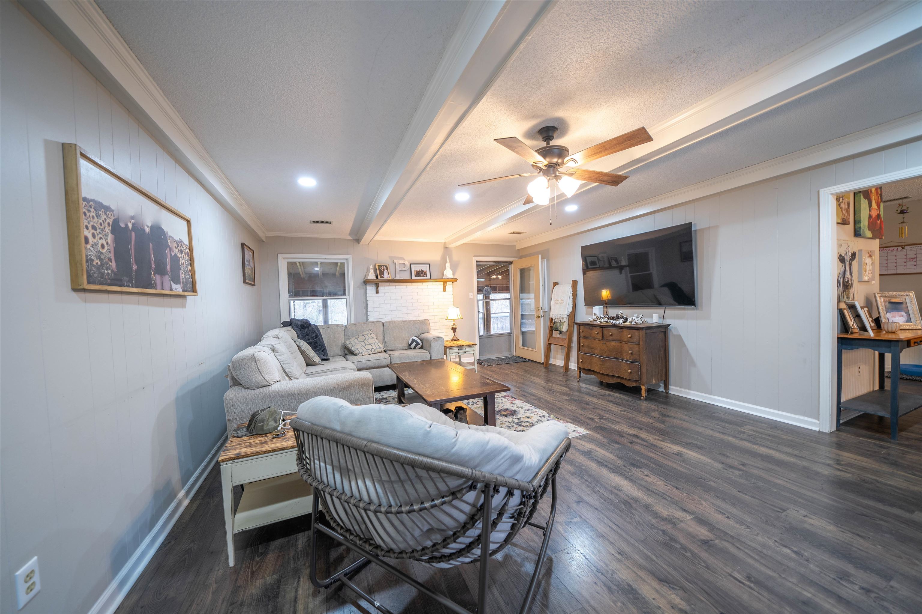 285 Woodbridge Road Somerville, TN 38068 - Photo 8 of 24 a living room with furniture a flat screen tv and kitchen view
