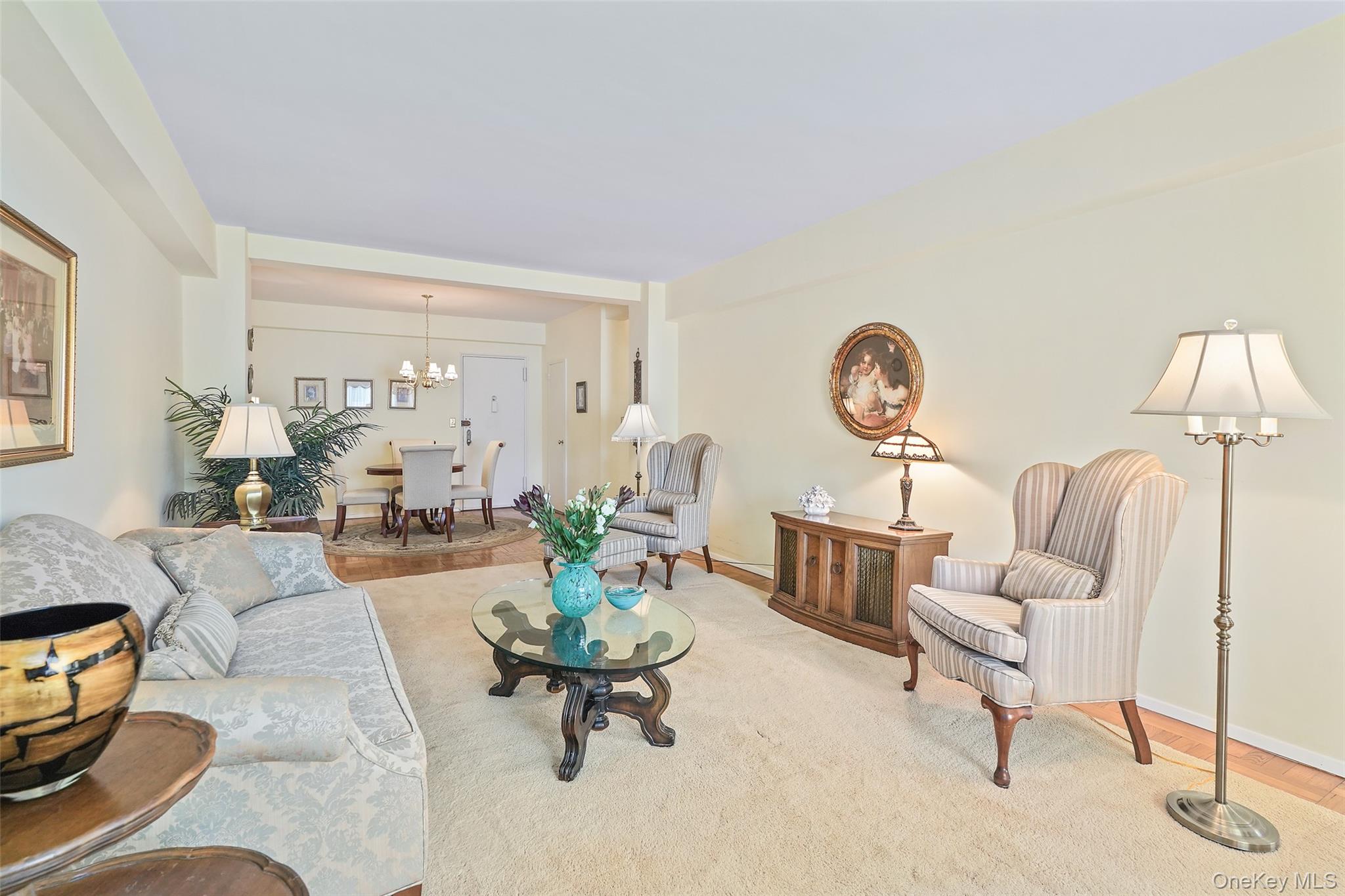 900 Palmer Road, Unit 5A Bronxville, NY 10708 - Photo 3 of 15 a living room with furniture and a large window