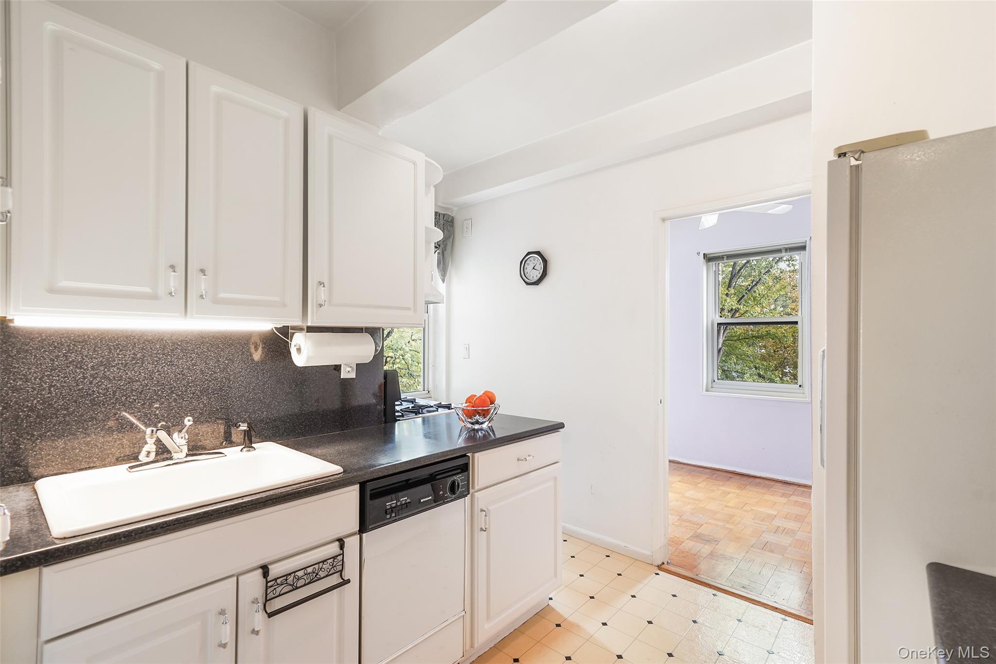 900 Palmer Road, Unit 5A Bronxville, NY 10708 - Photo 4 of 15 a bathroom with a sink and a mirror