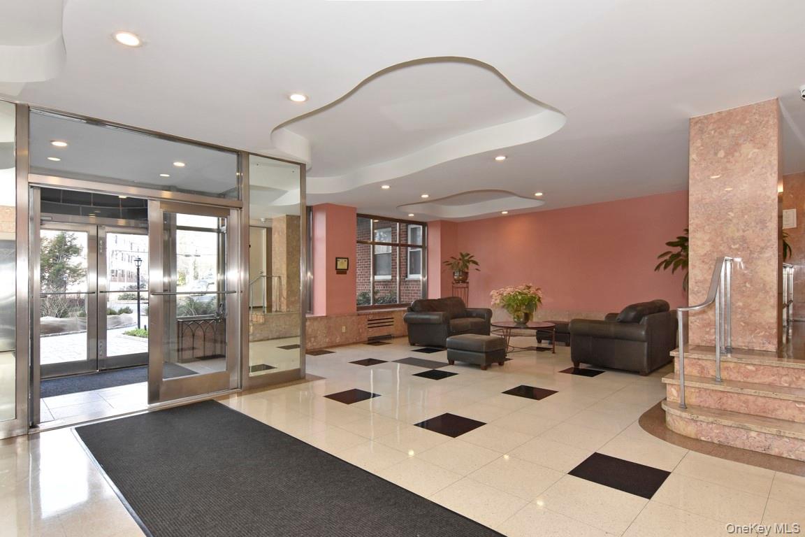 900 Palmer Road, Unit 5A Bronxville, NY 10708 - Photo 10 of 15 a large white kitchen with a large window