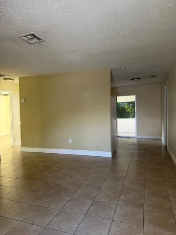 a view of an empty room and window