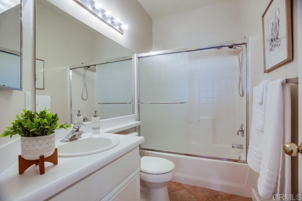 6094 Citracado Circle Carlsbad, CA 92009 - Photo 21 of 47 a bathroom with a sink toilet and shower