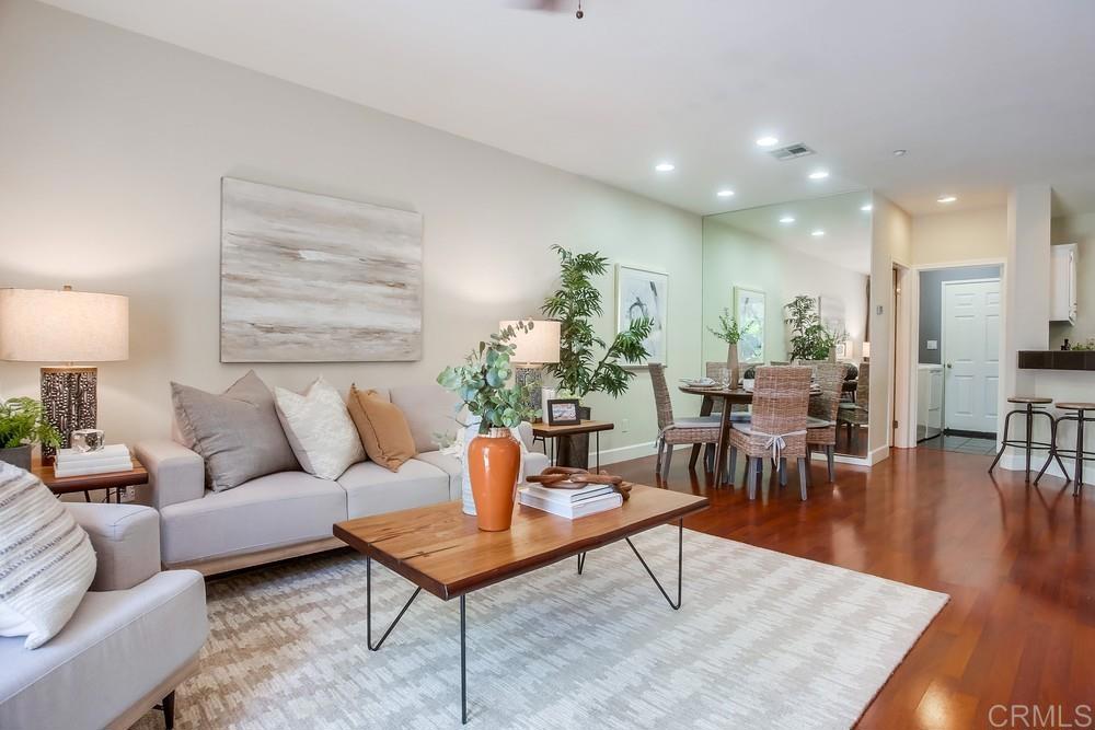 6094 Citracado Circle Carlsbad, CA 92009 - Photo 9 of 47 a living room with furniture a lamp a rug and a table