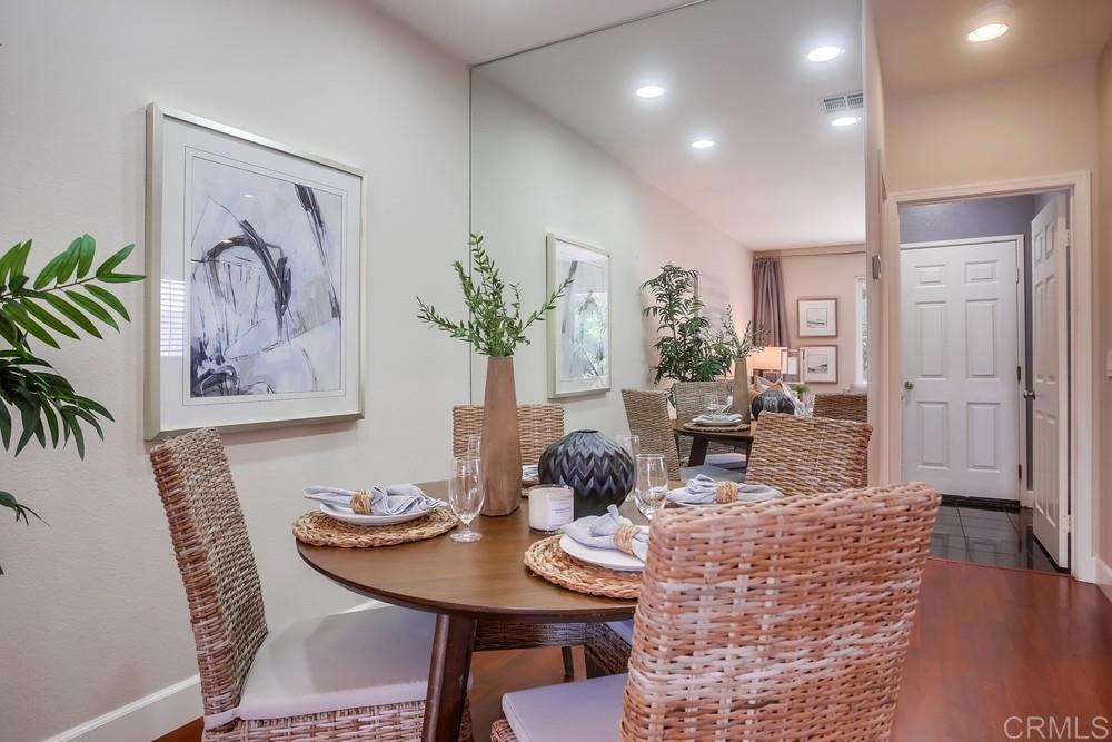 6094 Citracado Circle Carlsbad, CA 92009 - Photo 10 of 47 a view of a dining room with furniture and wooden floor