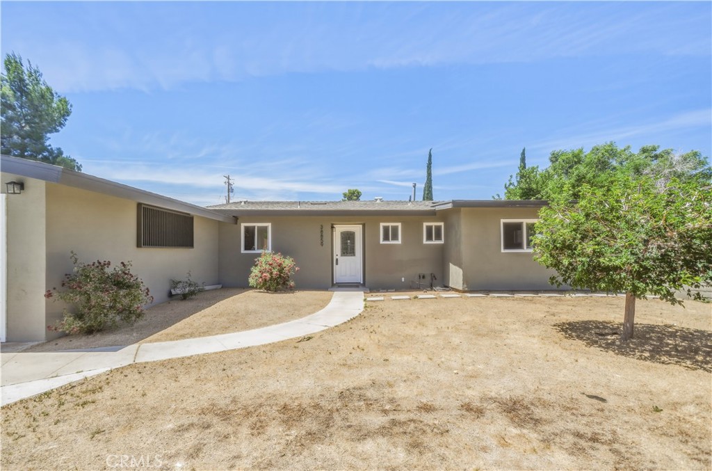 38859 Mesquite Road Palmdale, CA 93551 - Photo 2 of 36 a front view of a house with a yard and garage
