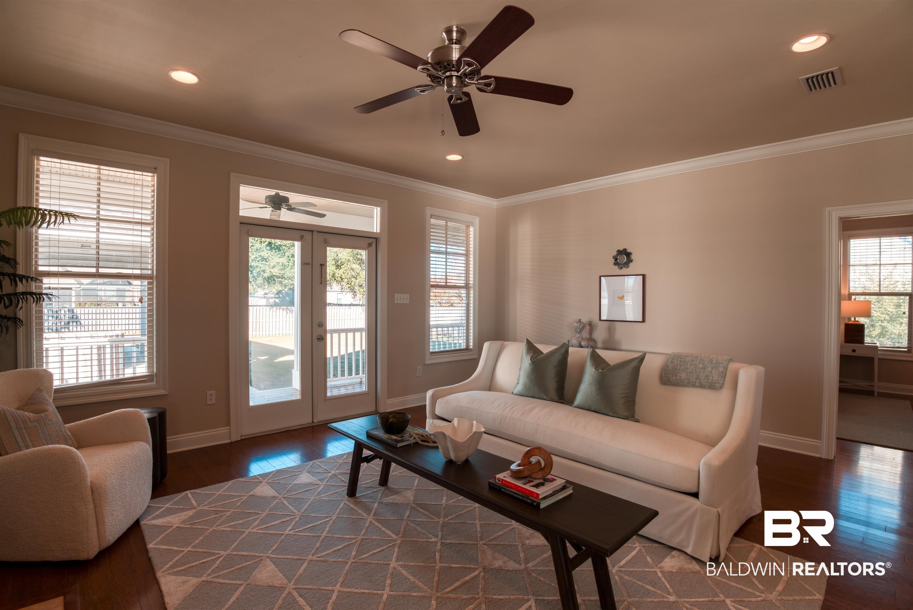 24561 Austin Road Daphne, AL 36526 - Photo 15 of 57 Living room with ceiling fan, dark hardwood / wood-style flooring, french doors, and ornamental molding