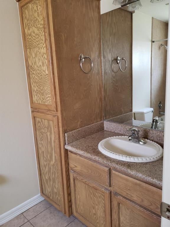 3902 South Radisson Avenue Pharr, TX 78577 - Photo 5 of 8 a bathroom with a sink a mirror a vanity and a shower