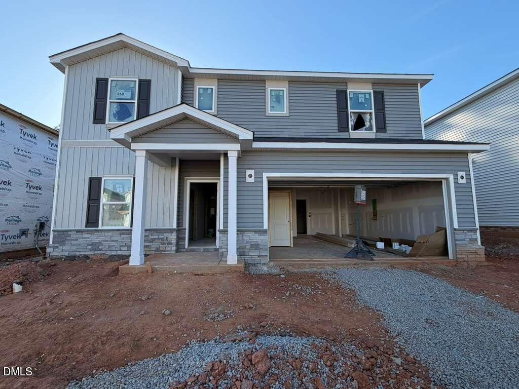 308 Karlov Road Garner, NC 27529 - Photo 4 of 55 a front view of a house with a yard