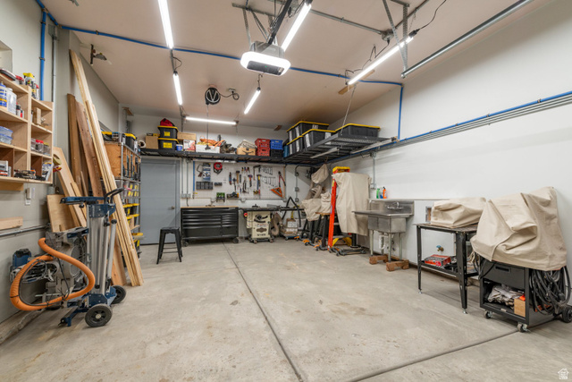 262 North Santa Fe Drive Mapleton, UT 84664 - Photo 24 of 28 Garage featuring a workshop area and a garage door opener