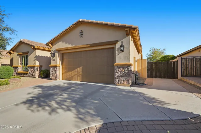 a view of a bedroom with furniture and window
